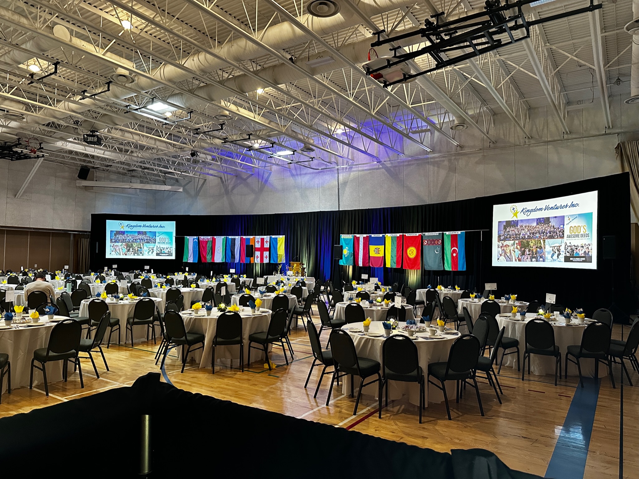 Gala banquet with international flags for Kingdom Ventures Inc.