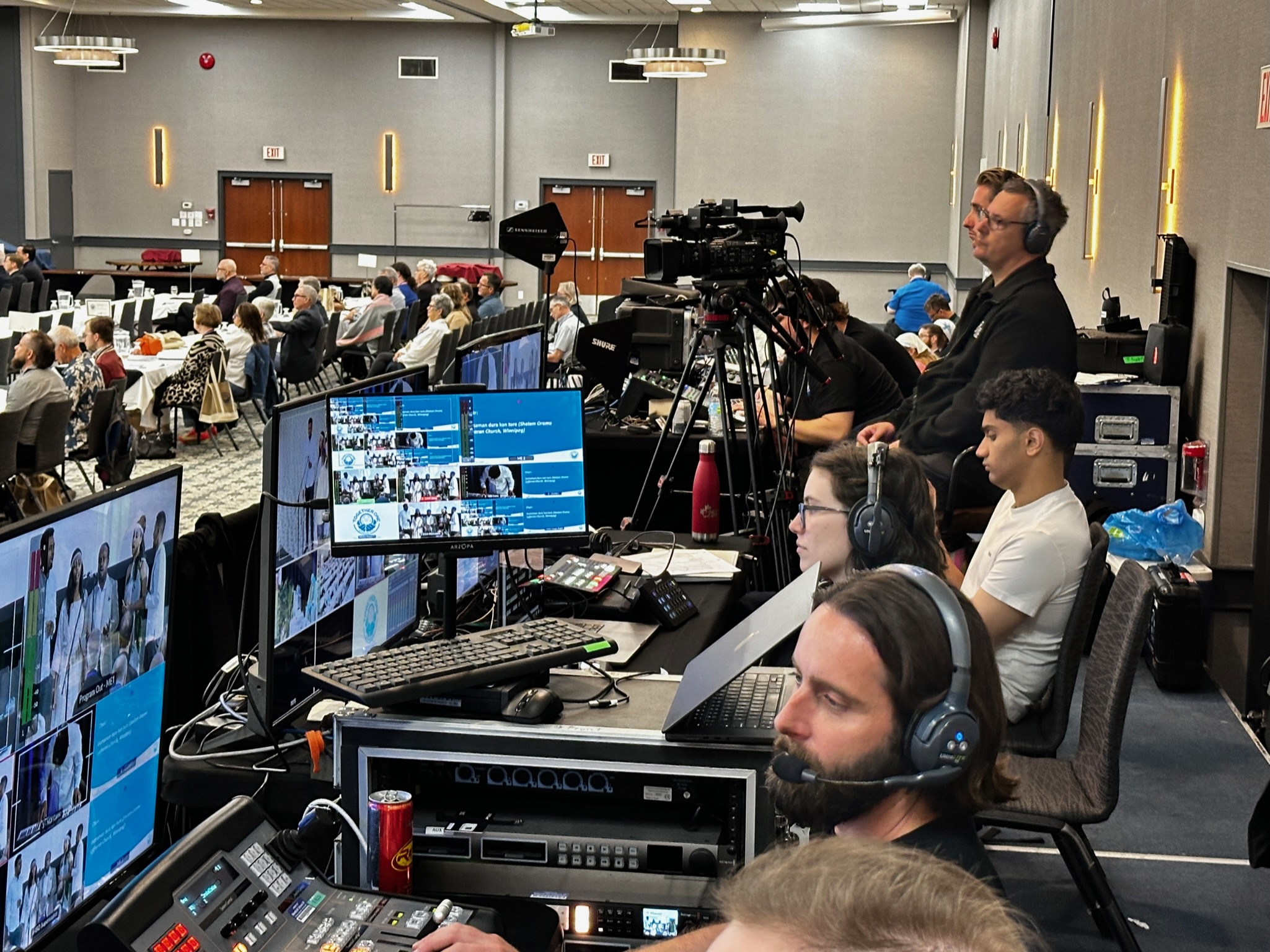 Broadcast tech table with multiview monitors and camera at the LCC convention